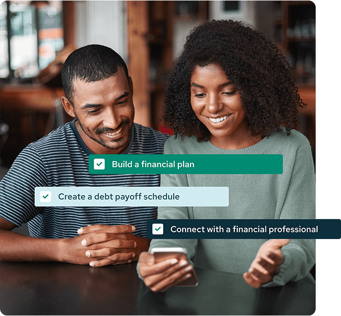 A couple reviewing their Savology financial plan together on a phone
